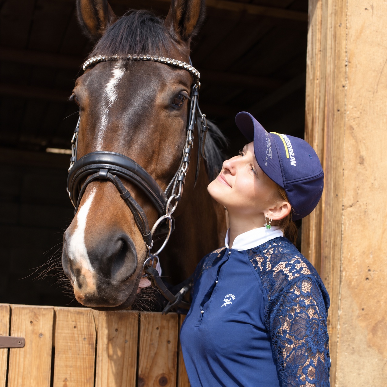 Deneal Van Wyk with a horse at the stables
