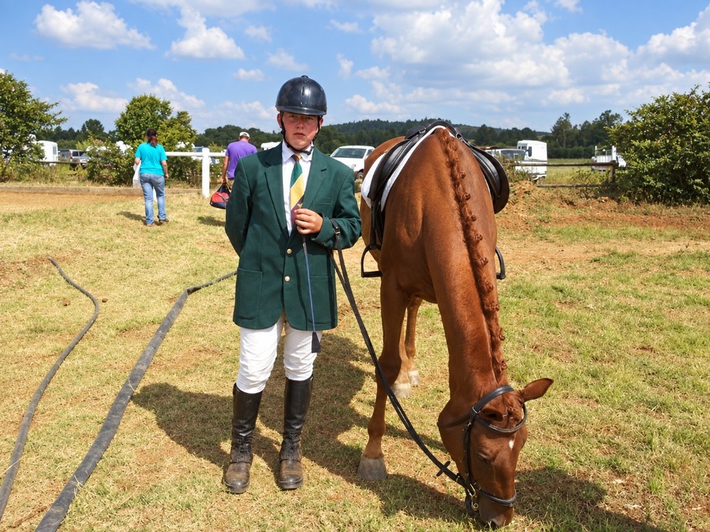Junior rider with a chestnut after a class