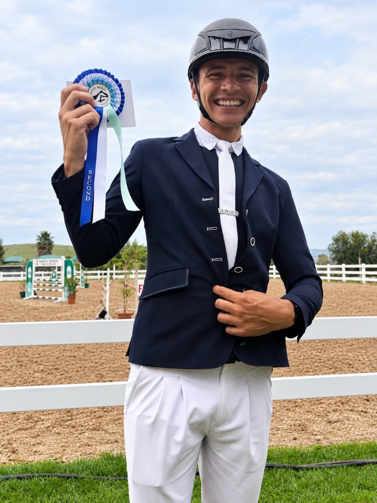Rider holding a competition rosette