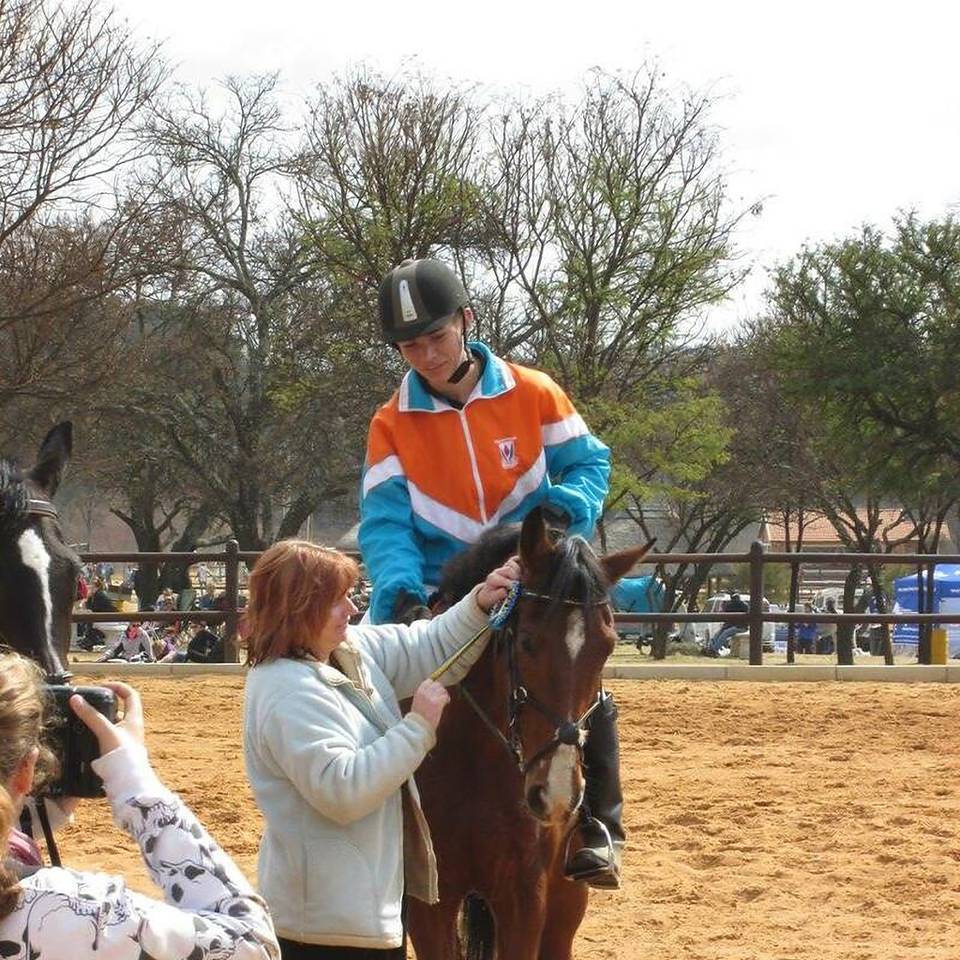 Emile Egen as a junior rider with family at the yard